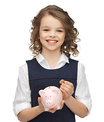 Image showing girl with piggy bank