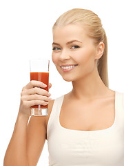 Image showing woman holding glass of tomato juice