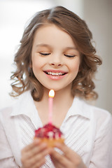 Image showing girl with cupcake