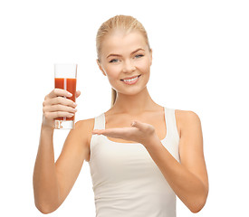 Image showing woman holding glass of tomato juice