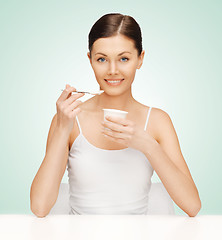 Image showing woman with yogurt