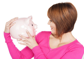 Image showing lovely woman with piggy bank