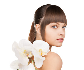 Image showing lovely woman with orchid flower