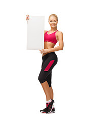 Image showing sportswoman with white blank board