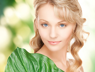 Image showing woman with green leaf