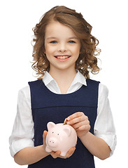 Image showing girl with piggy bank