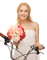 Image showing country girl with bicycle and flowers