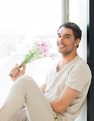 Image showing man holding bouquet of flowers