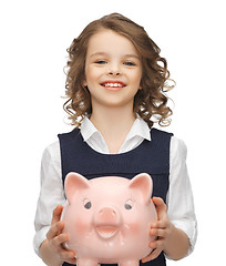 Image showing girl with piggy bank