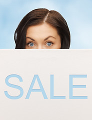 Image showing lovely woman with sale billboard