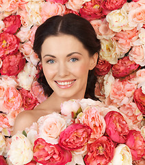 Image showing woman with background full of roses