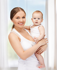 Image showing happy mother with adorable baby