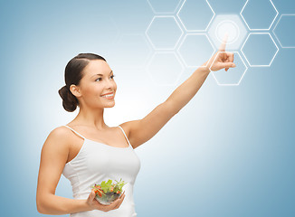 Image showing woman with salad and virtual screen