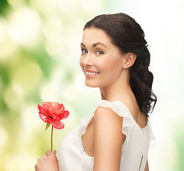 Image showing young and beautiful woman with flower