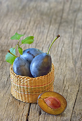 Image showing basket with plums