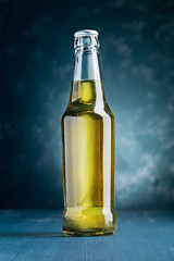 Image showing alcoholic beverage bottle on blue background