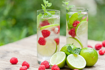 Image showing fresh cold drink water ice cubes peppermint lime raspberry