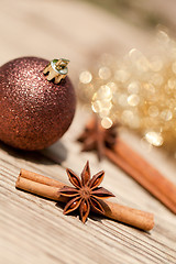 Image showing anice cinnamon and bauble christmas decoration in gold