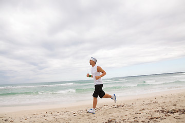 Image showing man is jogging on the beach summertime sport fitness