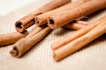 Image showing aromatic cinnamon sticks detail macro closeup 