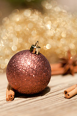 Image showing anice cinnamon and bauble christmas decoration in gold