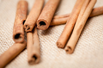 Image showing aromatic cinnamon sticks detail macro closeup 