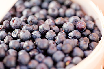 Image showing healthy fresh blueberries macro closeup on market outdoor