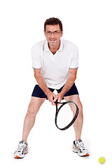 Image showing smiling adult tennis player with racket isolated