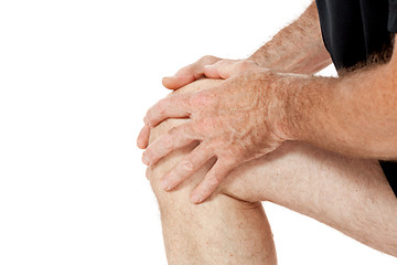 Image showing adult attractive man in sportswear knee pain injury ache isolated