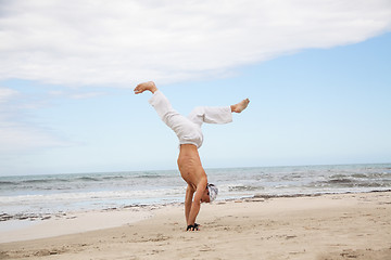 Image showing man is jumping sport karate martial arts fight kick