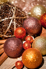 Image showing glittering christmas decoration in orange and brown natural wood 