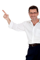 Image showing adult attractive smiling man pointing his finger on the copyspace