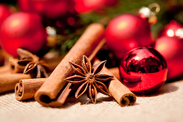 Image showing christmas decoration cinnamon anise baubles in red 