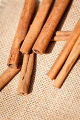 Image showing aromatic cinnamon sticks detail macro closeup 
