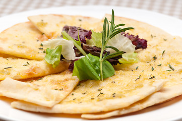 Image showing garlic pita bread pizza with salad on top