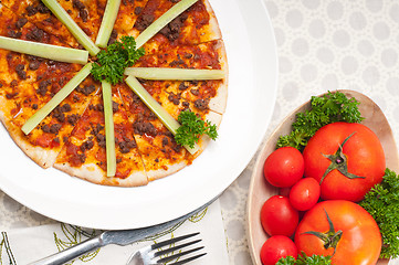 Image showing Turkish beef pizza with cucumber on top