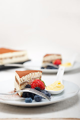 Image showing tiramisu dessert with berries and cream