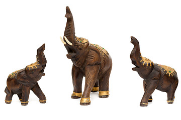 Image showing Three wooden statues of elephants