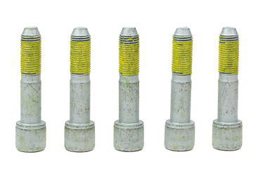 Image showing Five bolts for the car with the yellow glue on the threads