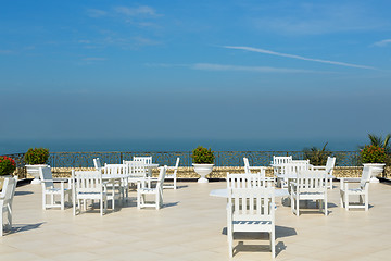 Image showing An empty rooftop restaurant with views of the sea