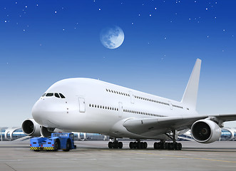 Image showing plane in the bright of the moon