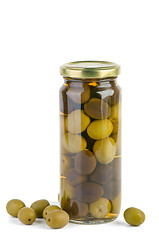 Image showing Glass jar with green and black olives . Some near