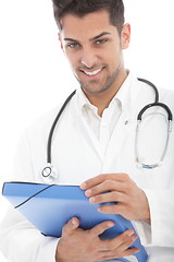 Image showing Young handsome male doctor with a file