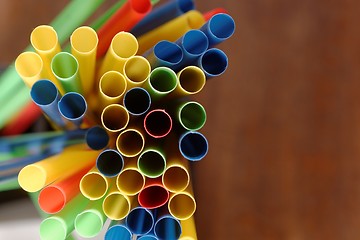 Image showing Colorful straws in a bar