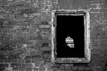 Image showing Red brick wall with window