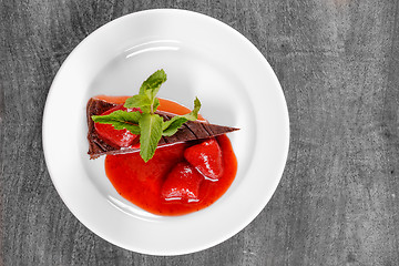 Image showing Chocolate cake wth strawberry and chili