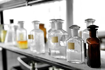 Image showing Photo of an old laboratory with a lot of bottles