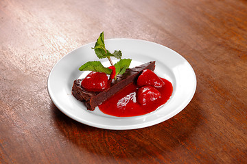 Image showing Chocolate cake wth strawberry and chili