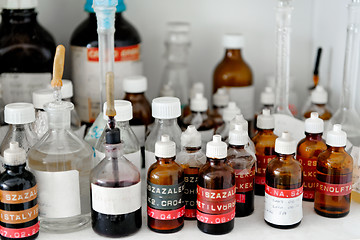 Image showing Photo of an old laboratory with a lot of bottles