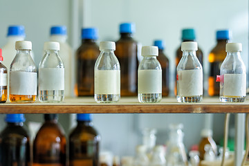 Image showing Photo of an old laboratory with a lot of bottles